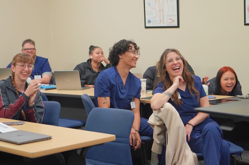 Students in lecture learning how to become a phlebotomist in California.