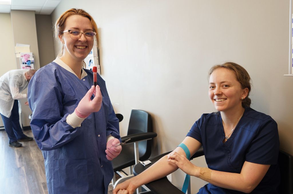 Phlebotomist students in Texas practice drawing blood.