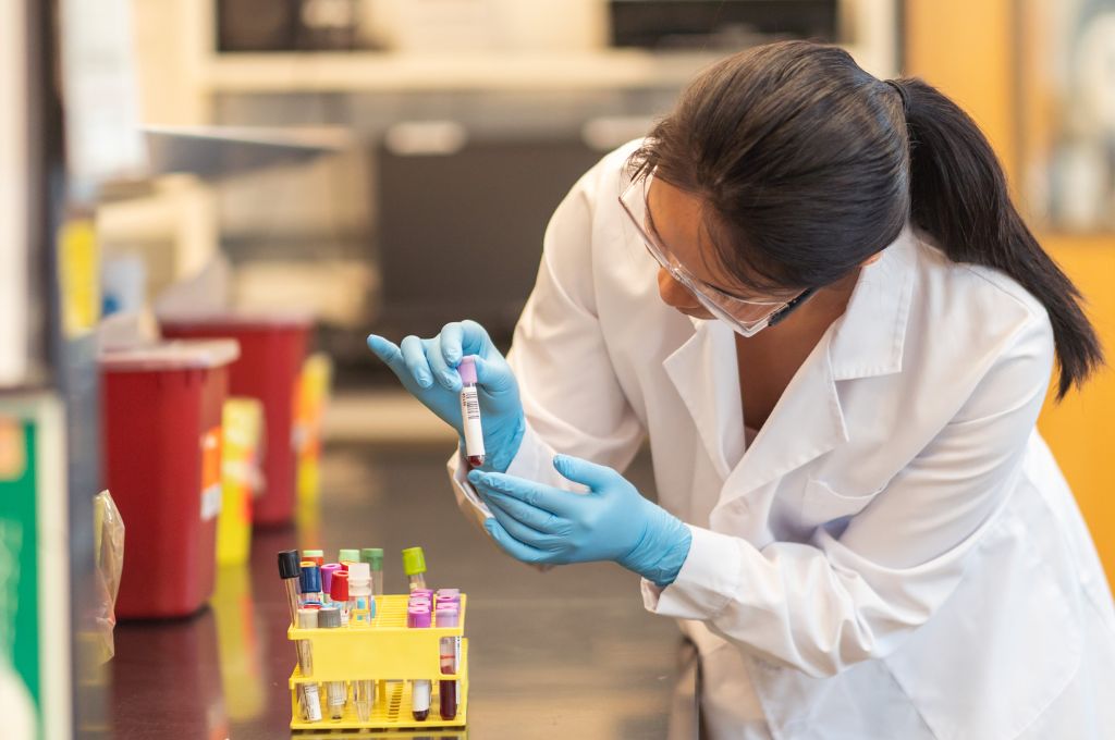 A phlebotomist storing blood draws.